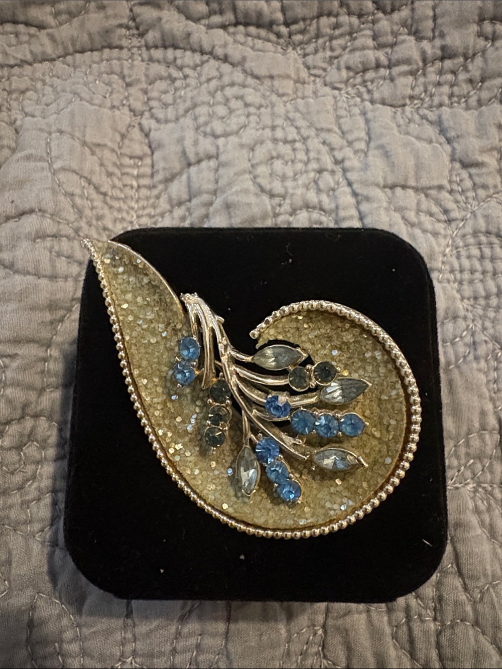 Silver-Tone Paisley Brooch with Blue Crystal Accents